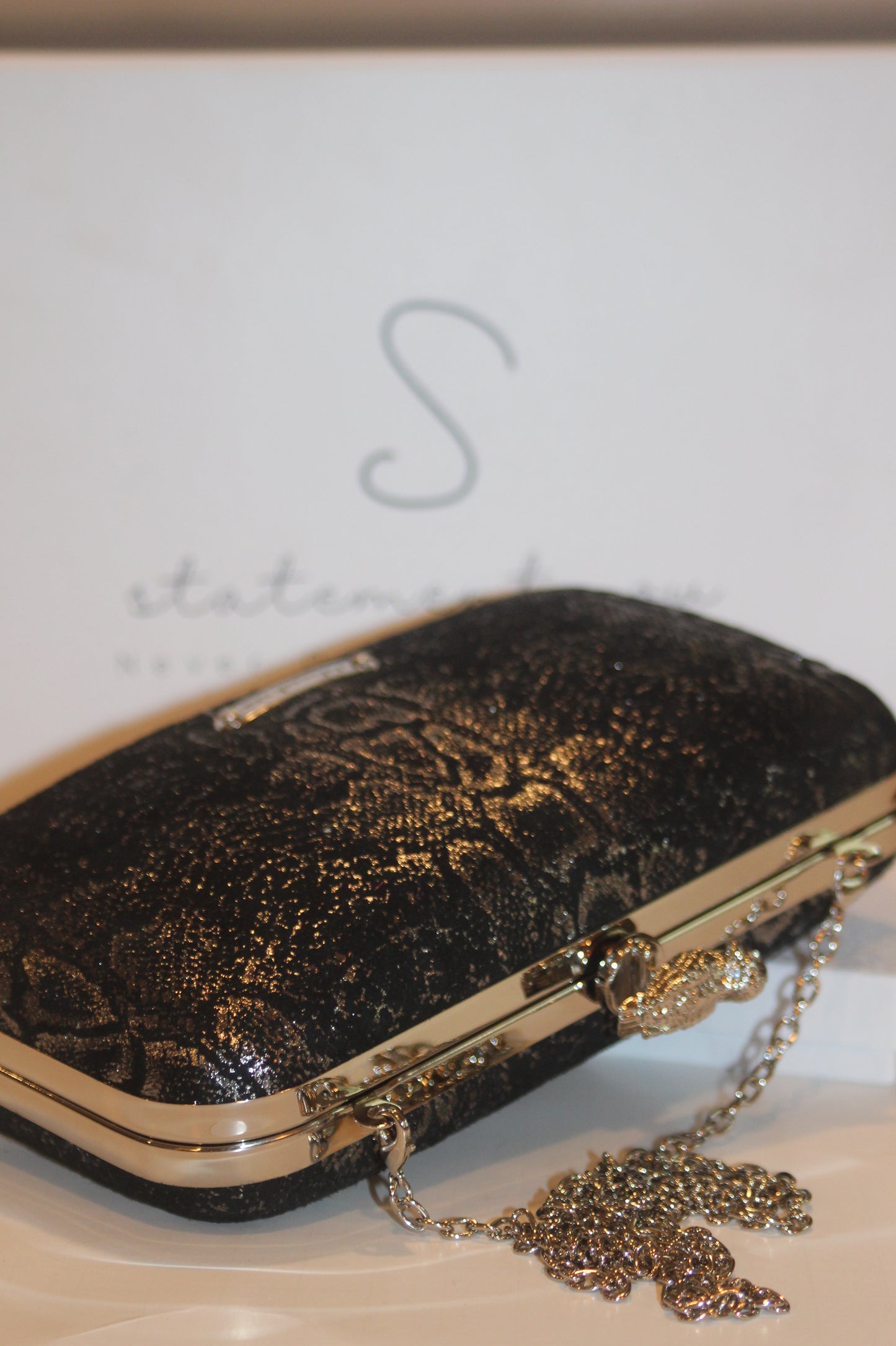 This bag is handcrafted with Italian l METALLIC SILVER SNAKE Print On Black Suede, Thin, Soft Italian Goatskin Goat Leather. The bag is topped with a silver-toned owl and a silver-tone frame.&nbsp;&nbsp. This eye-catching clutch bag is the ultimate evening and day accessory, which&nbsp;can be carried by hand or worn draped over the shoulder with the detachable chain strap.
Our Black Owl&nbsp; Woman Clutch Bag is whimsical and elegant. It is a rectangular clutch bag made especially for women who want to be 
