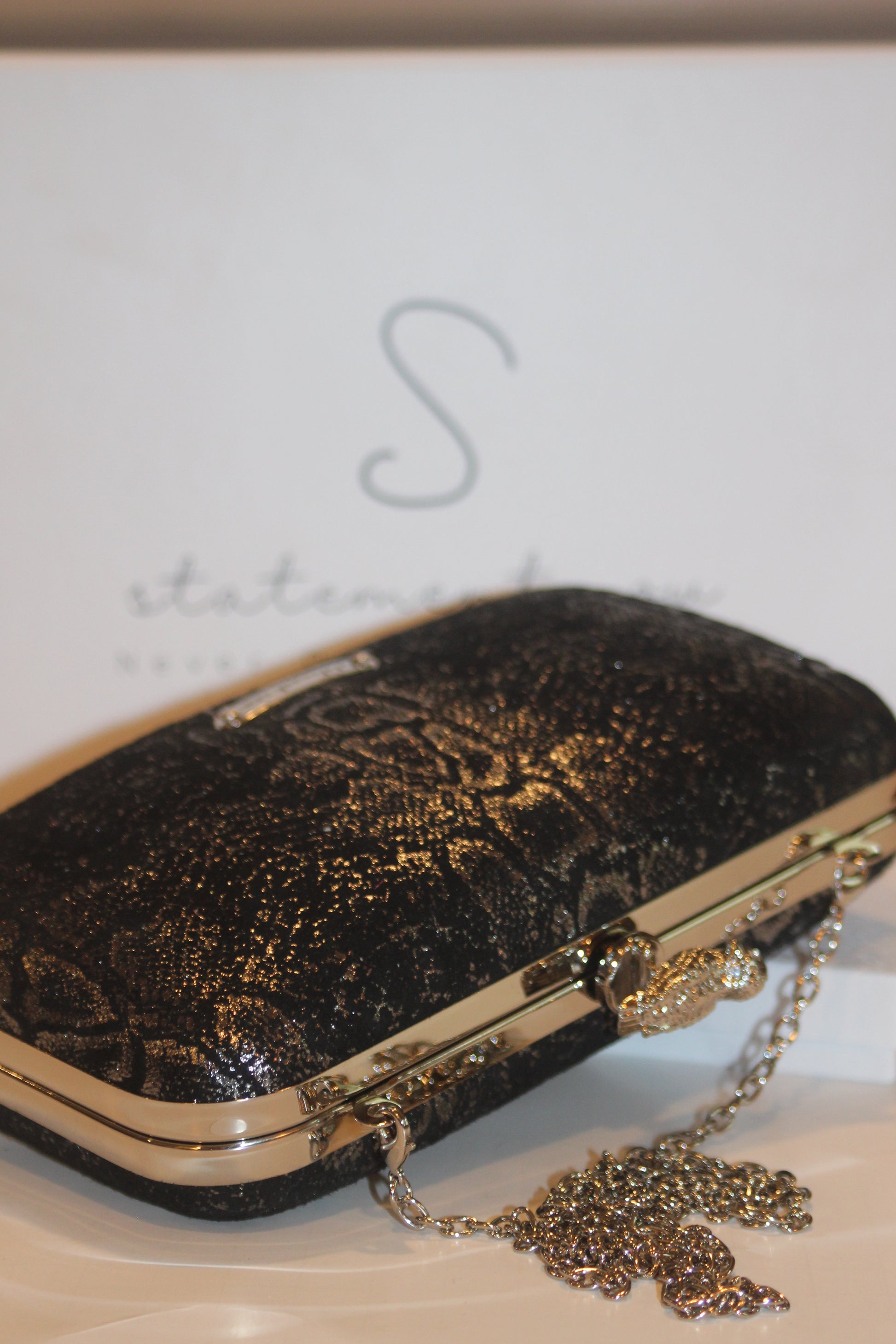 This bag is handcrafted with Italian l METALLIC SILVER SNAKE Print On Black Suede, Thin, Soft Italian Goatskin Goat Leather. The bag is topped with a silver-toned owl and a silver-tone frame.&nbsp;&nbsp. This eye-catching clutch bag is the ultimate evening and day accessory, which&nbsp;can be carried by hand or worn draped over the shoulder with the detachable chain strap.
Our Black Owl&nbsp; Woman Clutch Bag is whimsical and elegant. It is a rectangular clutch bag 
